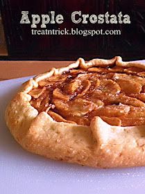 an apple crostaa pie sitting on top of a white plate