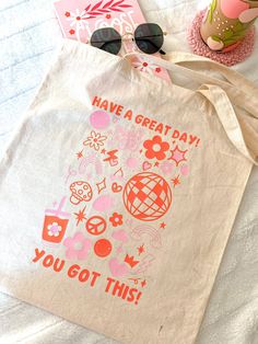 This “Have a Great Day” Reusable Cotton Tote Bag is the perfect bag for a day at the beach, a visit to the book store, or a day of shopping! This item is handmade with love to put a smile on your face! Grab your very own super cute and aesthetic tote bag and enjoy! ----- ♡ ------ Canvas Tote info: ♡ Includes ONE 15" x 16" 100% Cotton Tote Bag with Have a Great Day design. ♡ Design is made with high- quality, permanent heat- transfer vinyl. ----- ♡ Canvas Tote Bag Painting Ideas Easy, Tote Bag Painting Ideas Aesthetic, Tote Bag Design Ideas Aesthetic, Canvas Bag Painting Ideas, Girls Night Activities, Tote Bag Craft, Canvas Tote Bag Design, Face Grab, Bag Painting Ideas