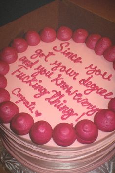 a birthday cake with pink frosting and writing on the top is in a box