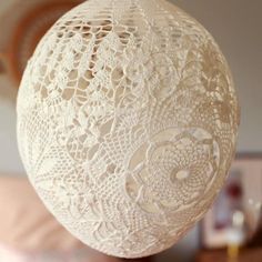 a close up of a white ball on a table with other items in the background