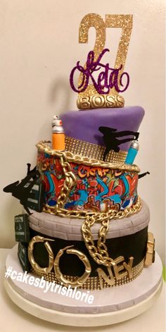 the cake is decorated with many different types of items and has a name on it