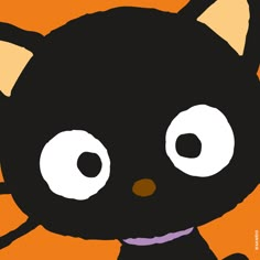 an image of a black cat with big eyes