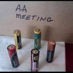 there are four aa batteries on the table