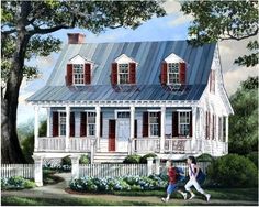 two people walking in front of a white house with red shutters on the windows