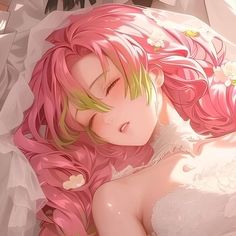 a woman laying on top of a bed covered in pink hair