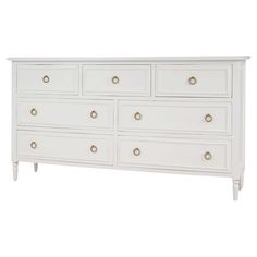 a white dresser with gold handles and drawers