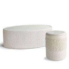 two white ceramic containers sitting next to each other