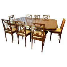 a dining room table with six chairs and one chair is missing the seat back end