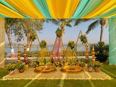 an outdoor wedding setup with flowers and decorations