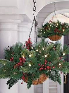 two hanging baskets filled with christmas decorations