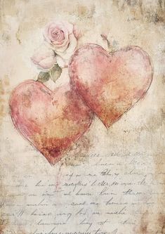 two hearts with roses are on top of an old paper