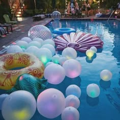 an inflatable pool filled with balloons and lights