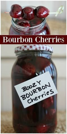 a jar filled with cherries sitting on top of a counter next to a sign that says bourbon cherries