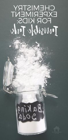 a glass jar filled with baking soda next to a chalkboard