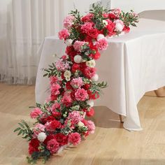 the table is covered with white and pink flowers