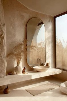 a bathroom with a large window and stone walls