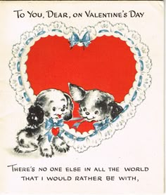 an old valentine card with two puppies and a heart