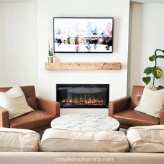 a living room with two couches and a fireplace