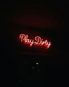 a red neon sign that says play dirty