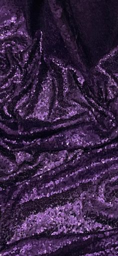 purple sequin fabric with black background