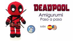 a crocheted deadpool amigurmi doll is posed next to an american flag