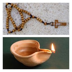 a small wooden bowl with a lit candle in it and a rosary on the wall