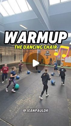 a group of people in a gym with balls and an advertisement for the dance chair