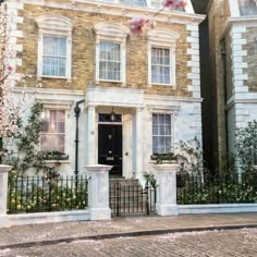 a large brick building with white trim and windows on the front door is surrounded by flowering trees