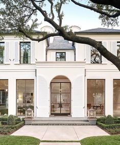 a large white house with lots of windows