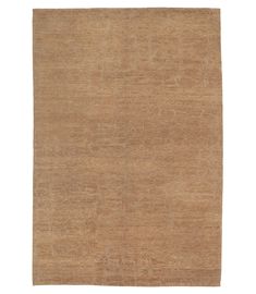 a beige rug on a white background with no one in the room to see it