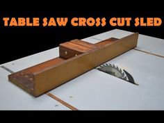 a table saw cross cut sled sitting on top of a white surface with text overlay