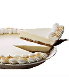 a cake with white frosting and two slices taken out of it on a plate