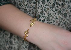 This dainty and intricate floral branch bracelet consists of a swirly branch like design loaded with lots of little forger-me-not flowers. It has two branches loaded with lots of lovely flowers growing out of each side. It has a tiny little pearl in the center of each flower.The metal base is flexible so it is very easy to adjust it to the wrist for a comfortable fit. * Comes wrapped in a beautiful gift package.* Could be requested in either 14k gold, rose gold or silver plated brass.For updates, new products, one-of-a-kind's, special offers and more- like me on Facebook:https://www.facebook.com/avigailadamjewelleryFollow me on instagram: http://instagram.com/avigailadamjewelry/