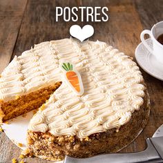 a carrot cake on a wooden table with a slice cut out and the words postres written above it