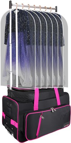 a suit case with clothes hanging from it's sides and pink straps on top