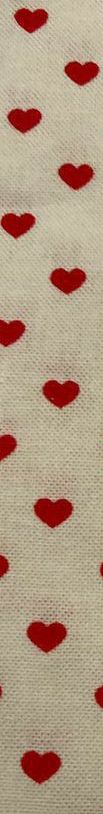 a red and white fabric with small circles on the top of it's surface