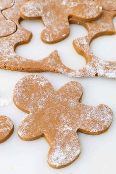 gingerbread cut out cookies with powdered sugar on top