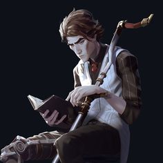 a young man sitting on top of a chair holding a book