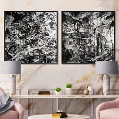 two black and white paintings in a living room