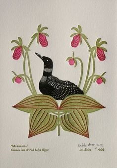 a black bird sitting on top of a green leafy plant next to pink flowers