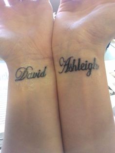 two people with matching wrist tattoos that say, david and ashlieigh on their wrists