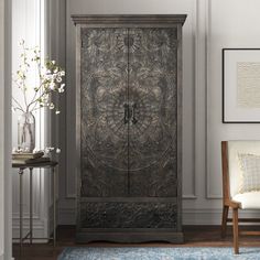 an ornate armoire in a living room