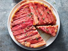 a meat pie with slices cut out on a plate