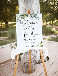 a welcome sign for a wedding with greenery on it and the words'welcome to the parker family reunion '