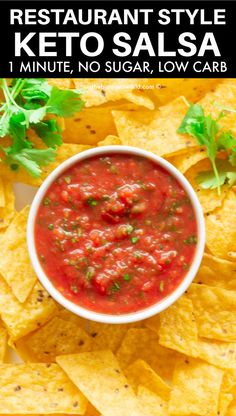 a white bowl filled with salsa surrounded by tortilla chips