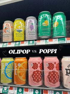 cans of sodas are on display for sale in a grocery store with the caption ollipop vs popi