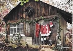 an old shed with clothes hanging out to dry