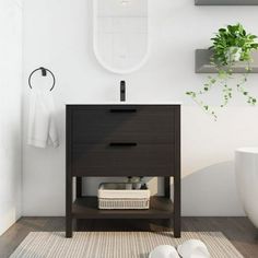 a bathroom with a sink, mirror and towel rack on the wall next to it