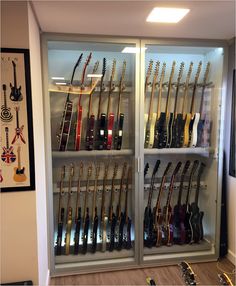 a display case with guitars and other musical instruments