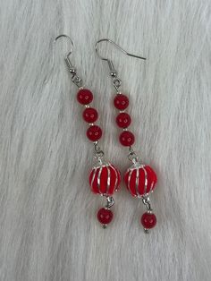 Hi Everyone,  Handmade Earrings, Red, Beads, Silver Petite Beads, Red, Pom Pom, Silver Dangle Earrings. Handmade fashion jewelry accessories perfect simple gifts for her or a special friend. So fun earrings.  Can be for everyday look for women and her fashion accessory. The length is about 3 inches from top to bottom.  Thank you for looking at my jewelry shop. Red Round Beads Earrings For Christmas, Red Earrings With Colorful Beads For Christmas, Red Round Beaded Earrings For Christmas, Christmas Red Beaded Earrings With Colorful Beads, Red Christmas Earrings With Colorful Beads, Christmas Red Earrings With Colorful Beads, Christmas Red Beaded Earrings, Red Beaded Drop Earrings For Christmas, Festive Red Beaded Earrings For Pierced Ears